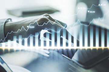 Abstract creative financial graph with finger clicks on a digital tablet on background, forex and...
