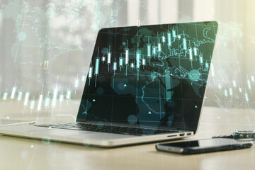 Double exposure of abstract creative financial diagram with world map on computer background, banking and accounting concept