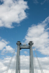 Support of the cable-stayed bridge against the background of beautiful clouds