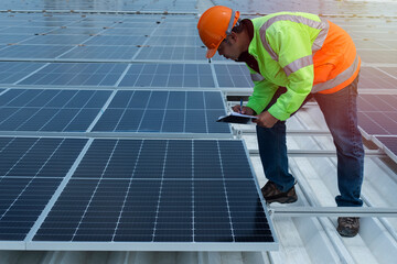 worker with Solar panels. Installation solar roof.
