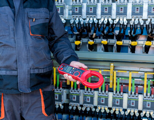 Checking the operating voltage levels of the solar panel switchgear compartment