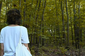 Close-up of young latina woman in autumn forest