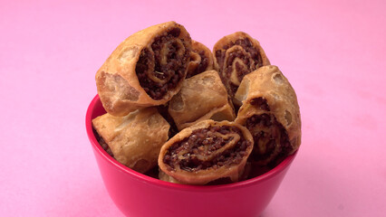 Indian traditional Snacks Bhakarvadi or Bakarvadi. Diwali snacks Bhakarwadi, selective focus.