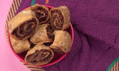 Indian traditional Snacks Bhakarvadi or Bakarvadi. Diwali snacks Bhakarwadi, selective focus.