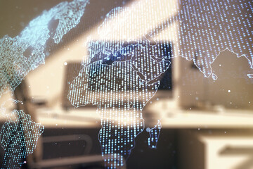 Multi exposure of abstract graphic world map and modern desk with computer on background, connection and communication concept
