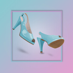 Elegant blue sandals with high heels on a trendy background illuminated by a blue and pink color gradient.