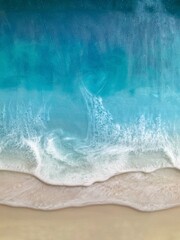 Top view on sea wave with white foam and light beige sand. Fluid, pour drawing of epoxy resin....