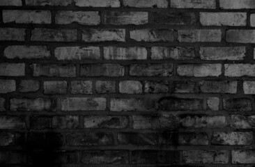 gray and black brick wall in city