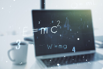 Creative scientific formula concept on modern laptop background. Multiexposure