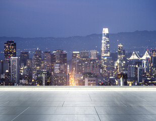 Empty concrete rooftop on the background of a beautiful blurry San Francisco city skyline at twilight, mock up