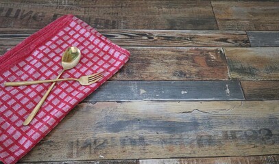 table with spoons and red cloth