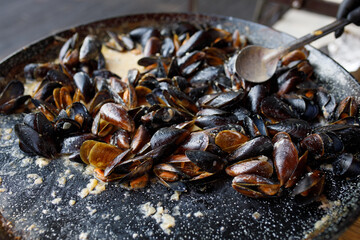 mussels are cooked on the street