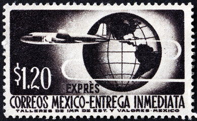Postage stamp Mexico 1962 plane circling globe