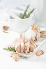 Fresh garlic bulbs with rosemary.