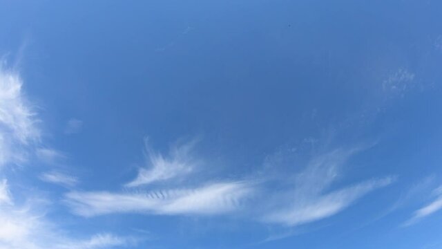 Thin cirrus clouds in the blue sky, time-lapse. Cloudy sky video.

