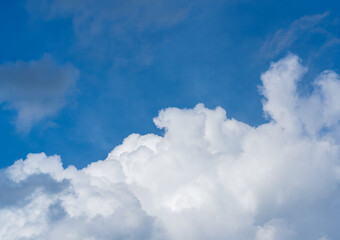 Naklejka na ściany i meble Bright blue clouds on a clear day