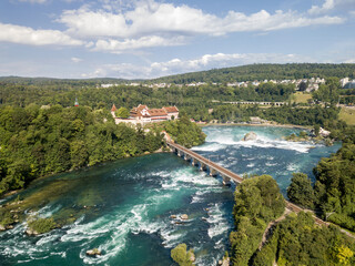 Fototapeta na wymiar Aerial photography with drone of Rhine Falls with Schloss Laufen castle, Switzerland. Rhine Falls is the largest waterfalls in Europe