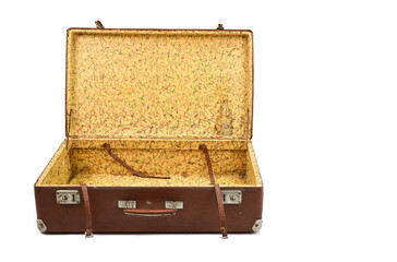 Old cardboard suitcase with metal corners and clasps. The suitcase is thrown open and straps for...