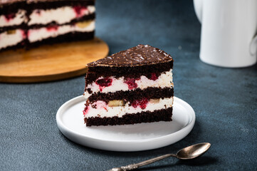 Chocolate cake with raspberry on plate. Slice of cake. Raspberry cake. Wedding dessert. Black forest cake. Delicious dessert. Traditional german dessert