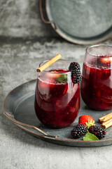Colada morada - traditional Ecuadorian drink, prepared with black corn flour and fruits such as naranjilla, babaco, pineapple, blackberries, strawberries