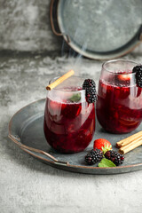 Colada morada - traditional Ecuadorian drink, prepared with black corn flour and fruits such as naranjilla, babaco, pineapple, blackberries, strawberries
