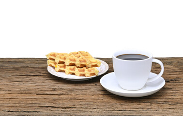 black coffee in white seramic glasses and waffle  on  wooden table