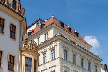 Fototapeta premium Facade of historical houses in Dresden Old Town. Many different renovated houses stand next to each other on Dresden's Neumarkt. 