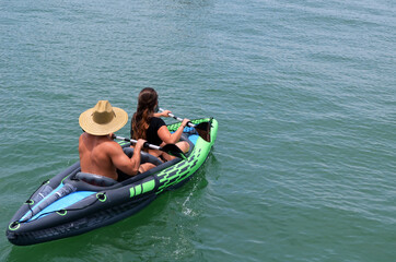 Couple in an inflatable canoe .