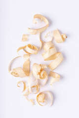Wooden shavings on white background. Wood shaving