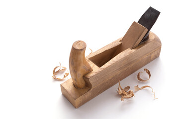 Plane tool carpenter or joiner and wooden shavings isolated on white background. Woodworking tools