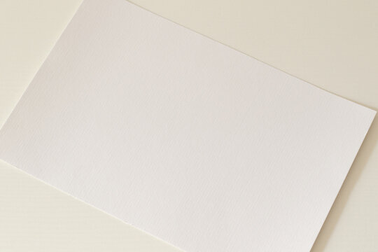 Blank Paper Sheet On White Table