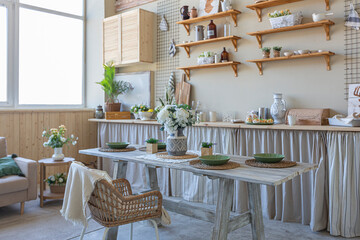 simple cozy home interior of an open plan ordinary room with a kitchen and bedroom area