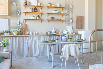 simple cozy home interior of an open plan ordinary room with a kitchen and bedroom area