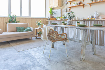 simple cozy home interior of an open plan ordinary room with a kitchen and bedroom area