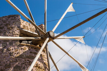 sunny windmill of stone and wood