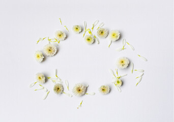 Paper white texture background with yellow flower empty frame . Flat lay.