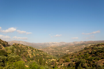 sunny valley in greece seen from hill