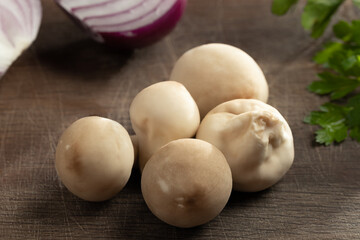 Cooking edible puffball mushrooms. Several whole mushrooms on a cutting board