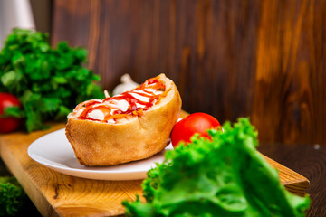 Hotdog with meat and sauce