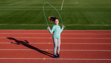 Rope skipping. Energetic child jump over skipping rope. Gymnastics. Fitness and sport