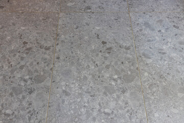 Close up view of marble tiles structure. Grey background texture. 