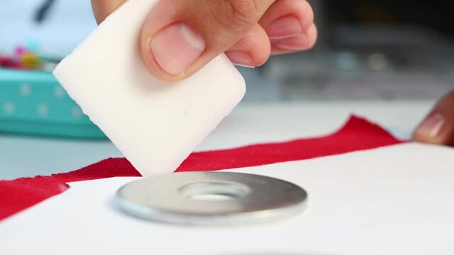 Closeup of designer marking the fabrics for future project