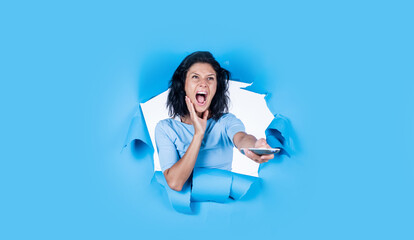 rejoicing at positive news. technology in modern life. portrait of caucasian female with brunette hair. turn on the tv. girl feeling happiness. happy young woman using remote control