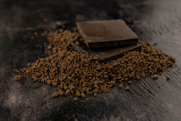 two bars of dark chocolate in a crumb