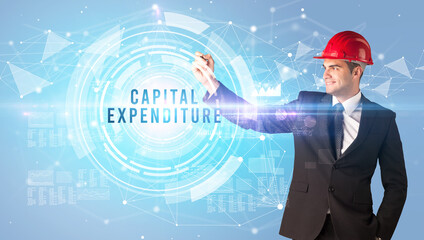 Handsome businessman with helmet drawing