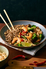asian noodles with shrimps squid vegetables