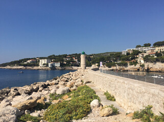 The Cassis lighthouse situated on the pier at the harbour's entrance on a summer sunny day, located in the Provence-Alpes-Côte d'Azur region, on the French Riviera in Southern France. 