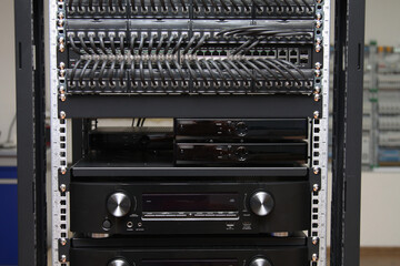 Audio amplifier for home theater, installed in a low-current rack.