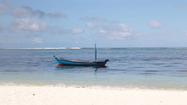 A boat at the sea near the coast on tropical island