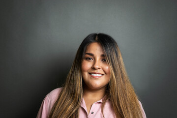 portrait of beautiful and happy Hispanic woman smiling. young mexican person